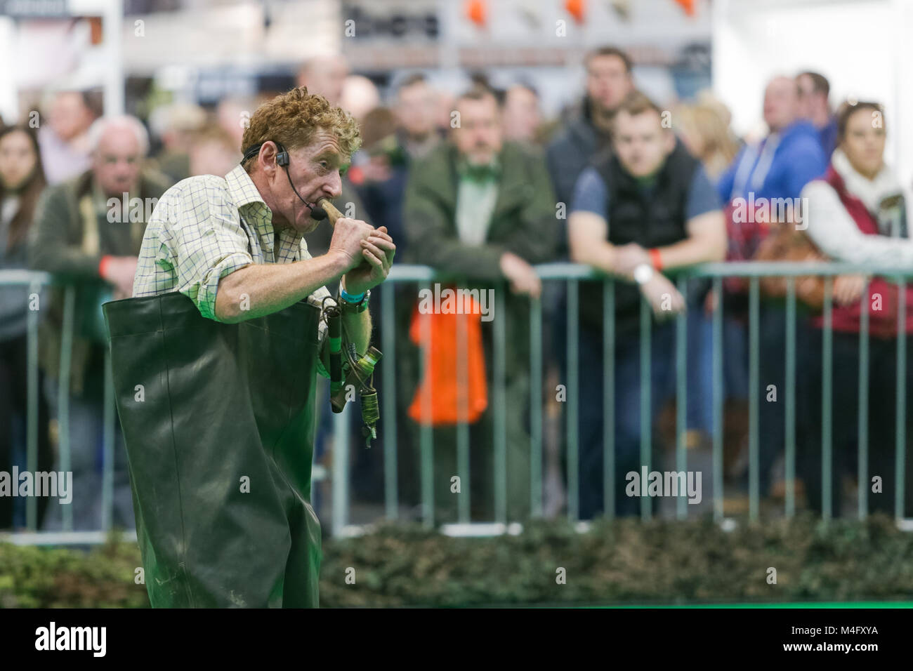 man demonstrating how to decoy for duck hunting at great british shooting show nec Stock Photo