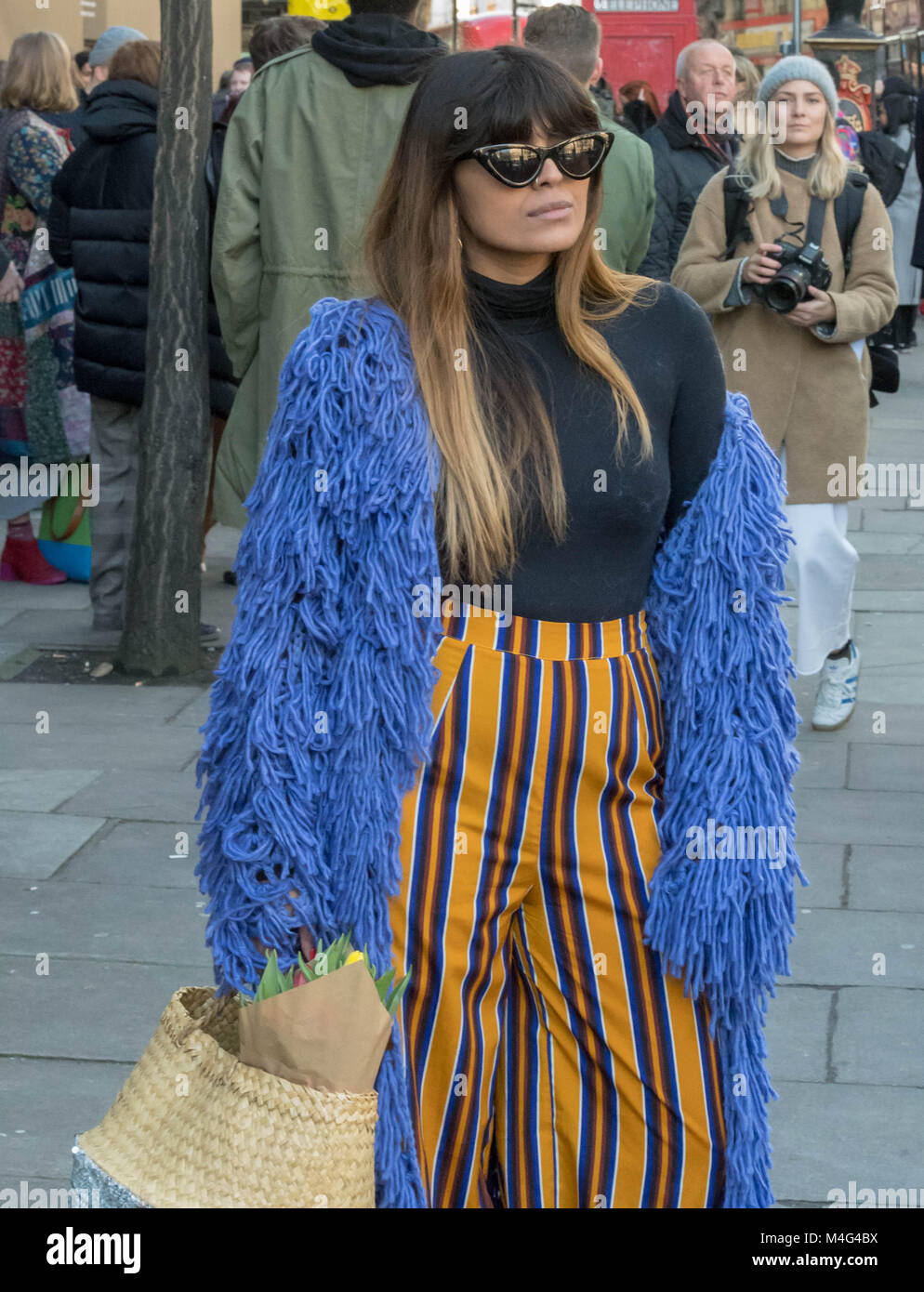 London 16th February 2018, Fashionista outside London Fashion Week venues. These are fashion following individuals who are showing off their fashion designs Credit: Ian Davidson/Alamy Live News Stock Photo
