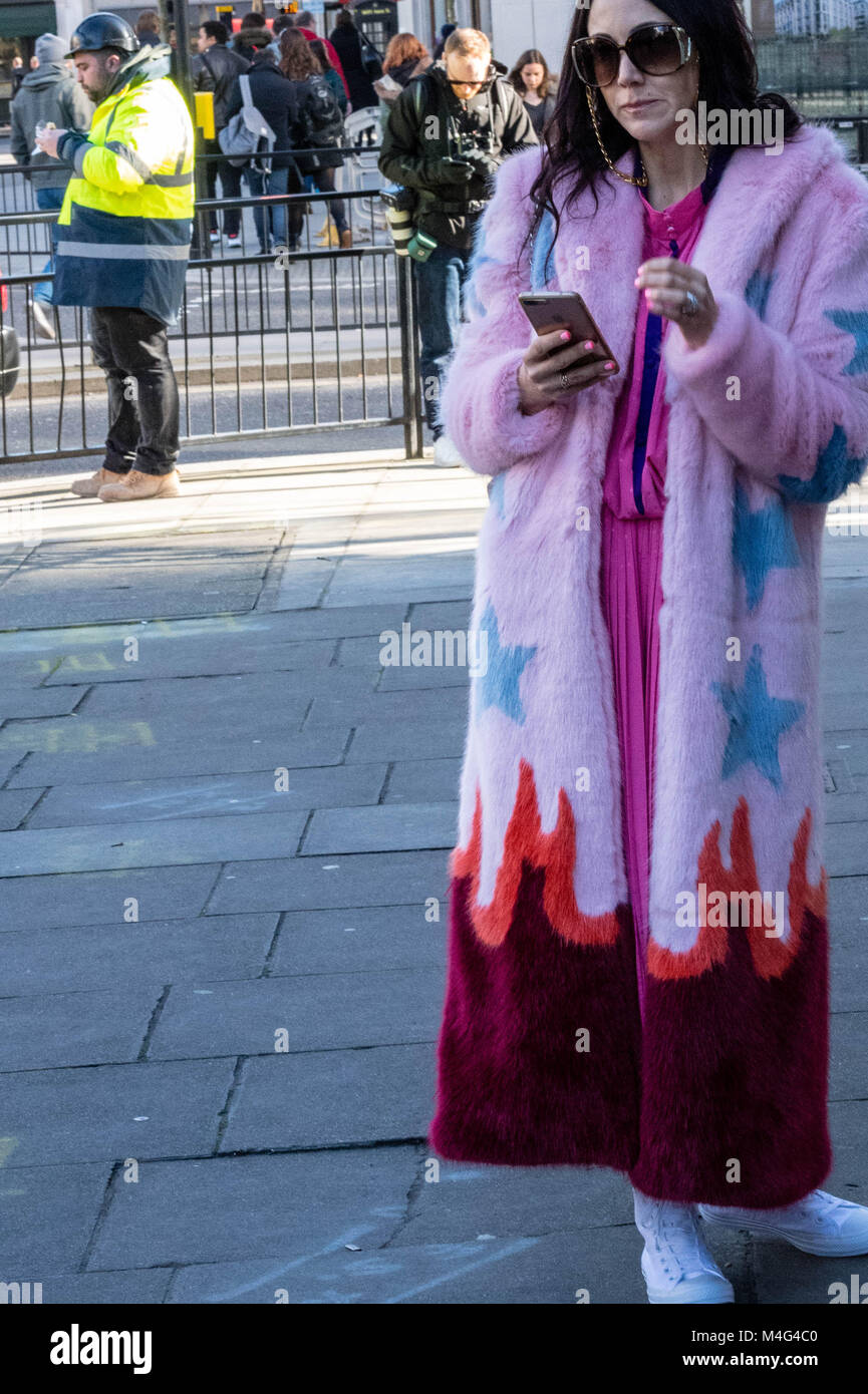 Fashionistas outside the London Fashion Week venues; they are fashion followers or young designers trying to publiscies their designs. Credit: Ian Davidson/Alamy Live News Stock Photo