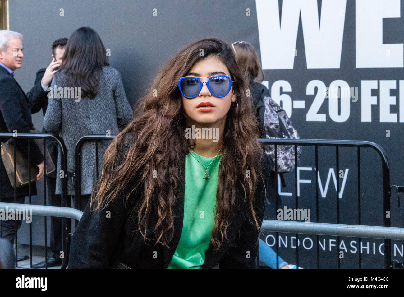 London 16th February 2018, Fashionistas outside the London Fashion Week venues; they are fashion followers or young designers trying to publiscies their designs. Credit: Ian Davidson/Alamy Live News Stock Photo
