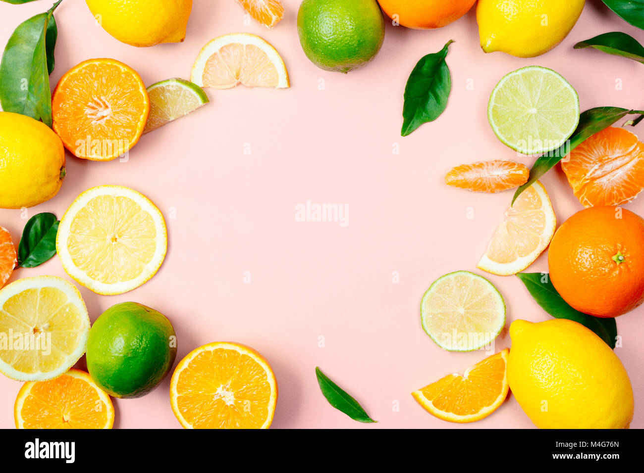 Flat lay of citrus fruits like lime, lemon, orange and tangerine with