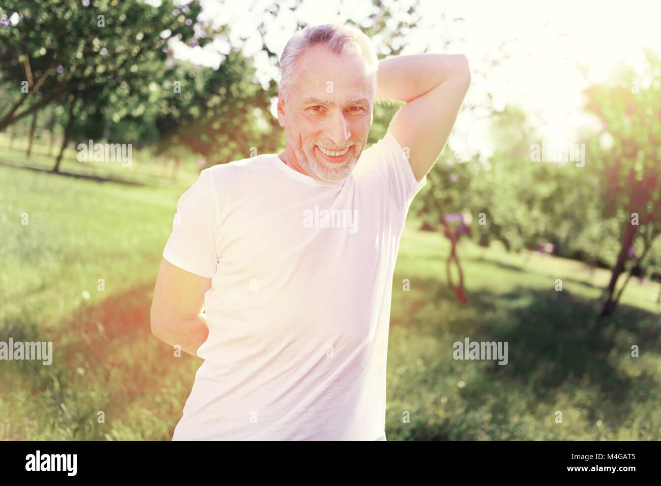 Portrait of enthusiastic man stretching hands Stock Photo