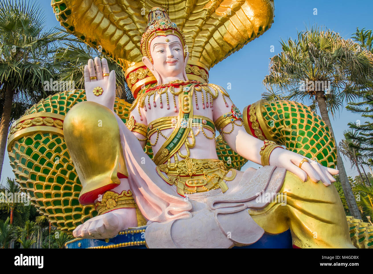 Seated Buddha with snake heads Stock Photo