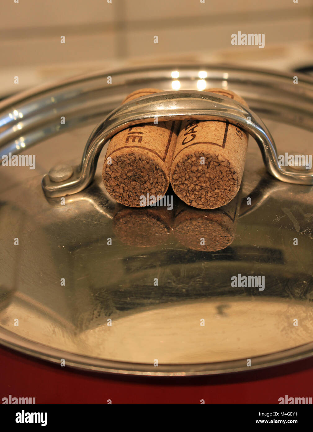 Corks for pan handles. Two wine bottle corks are being used to enable