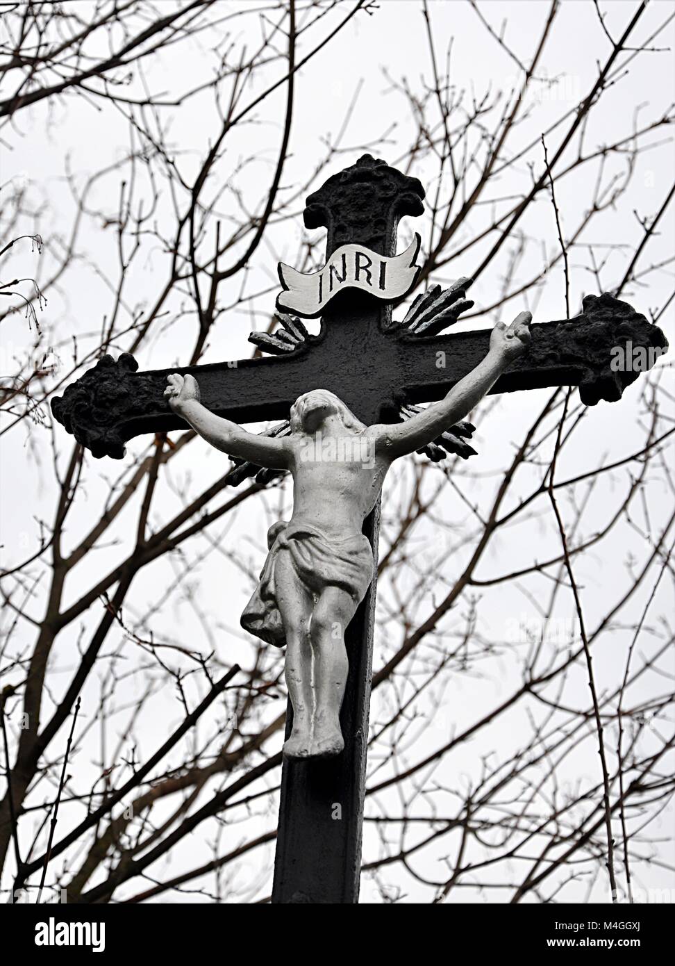 old catholic statue and cross Stock Photo Alamy