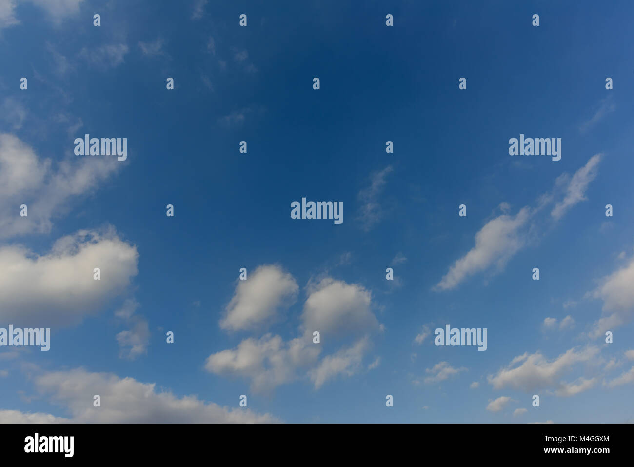 blue sky with fluffy white clouds on a bright summer day Stock Photo ...
