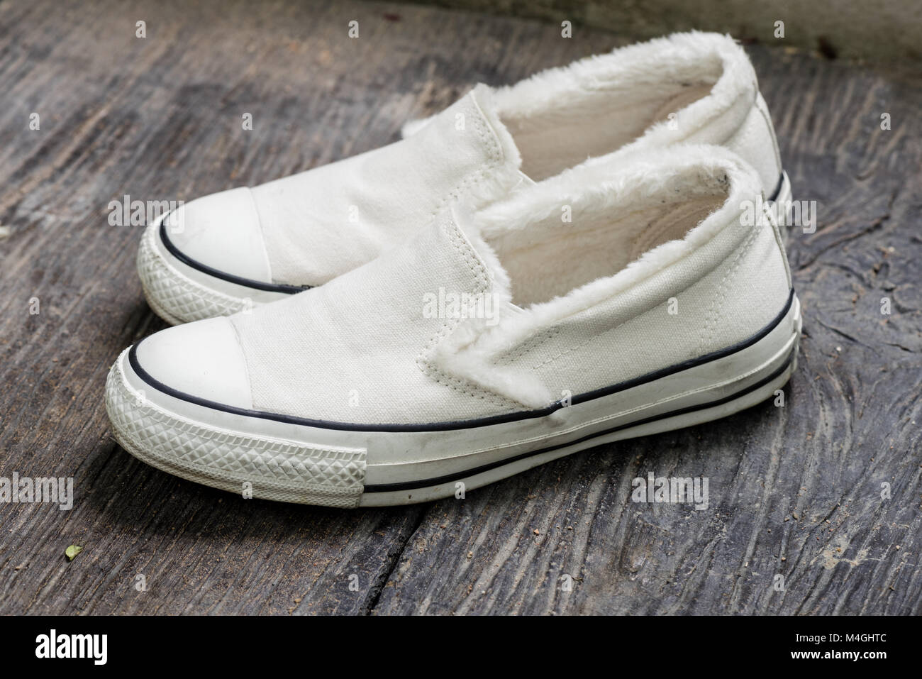 closeup the white women sneakers without laces Stock Photo - Alamy