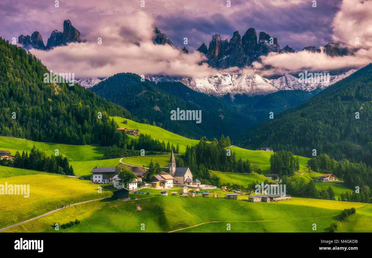Famous best alpine place of the world, Santa Maddalena (St Magdalena) village with magical Dolomites mountains in background, Val di Funes valley, Tre Stock Photo
