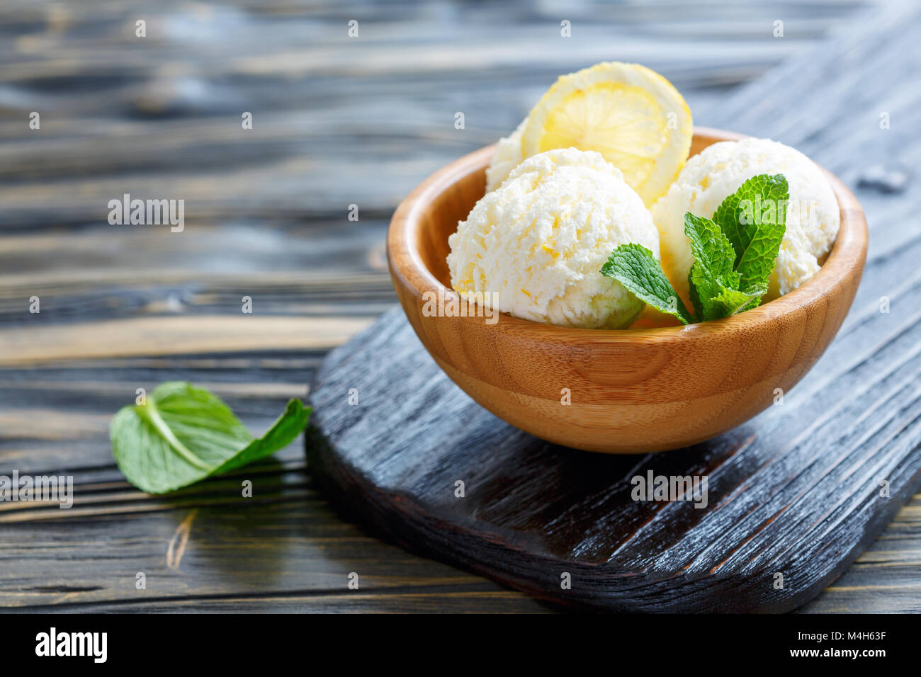 Homemade lemon ice cream and mint leaves. Stock Photo