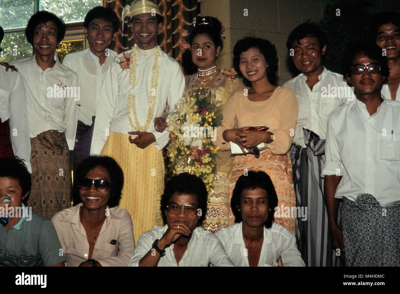 Thai Bride In Traditional Wedding Dresses With Family Members In