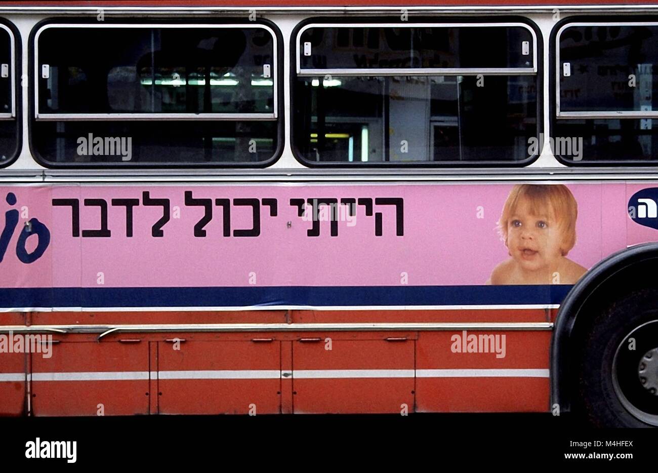 Advertising on a bus in Israel. Lettering in Hebrew Stock Photo Alamy