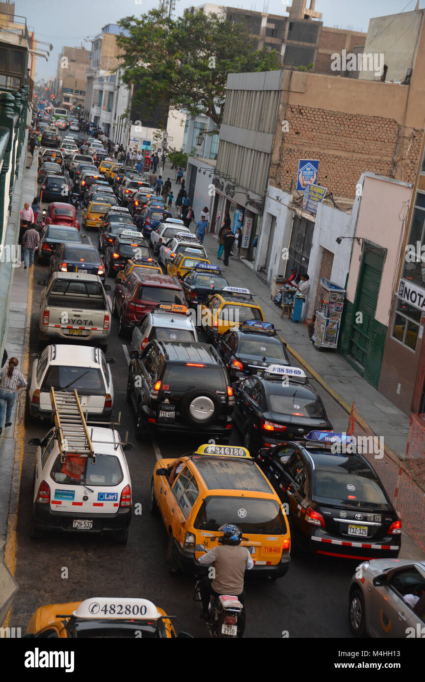 A very busy street jammed with dozens of cars in Trujillo, Peru Stock