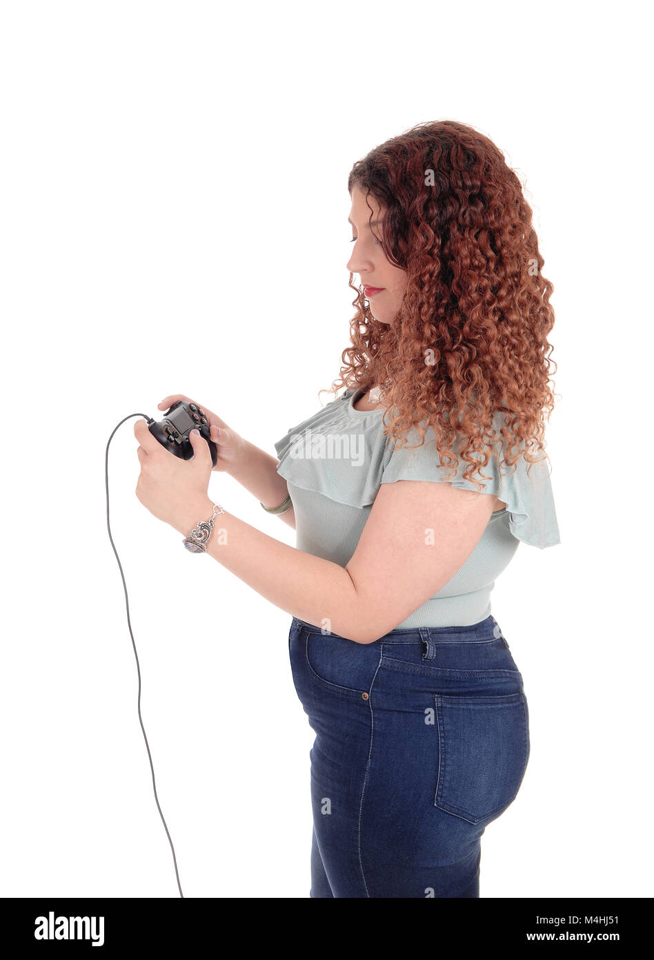 Woman playing her video game. Stock Photo