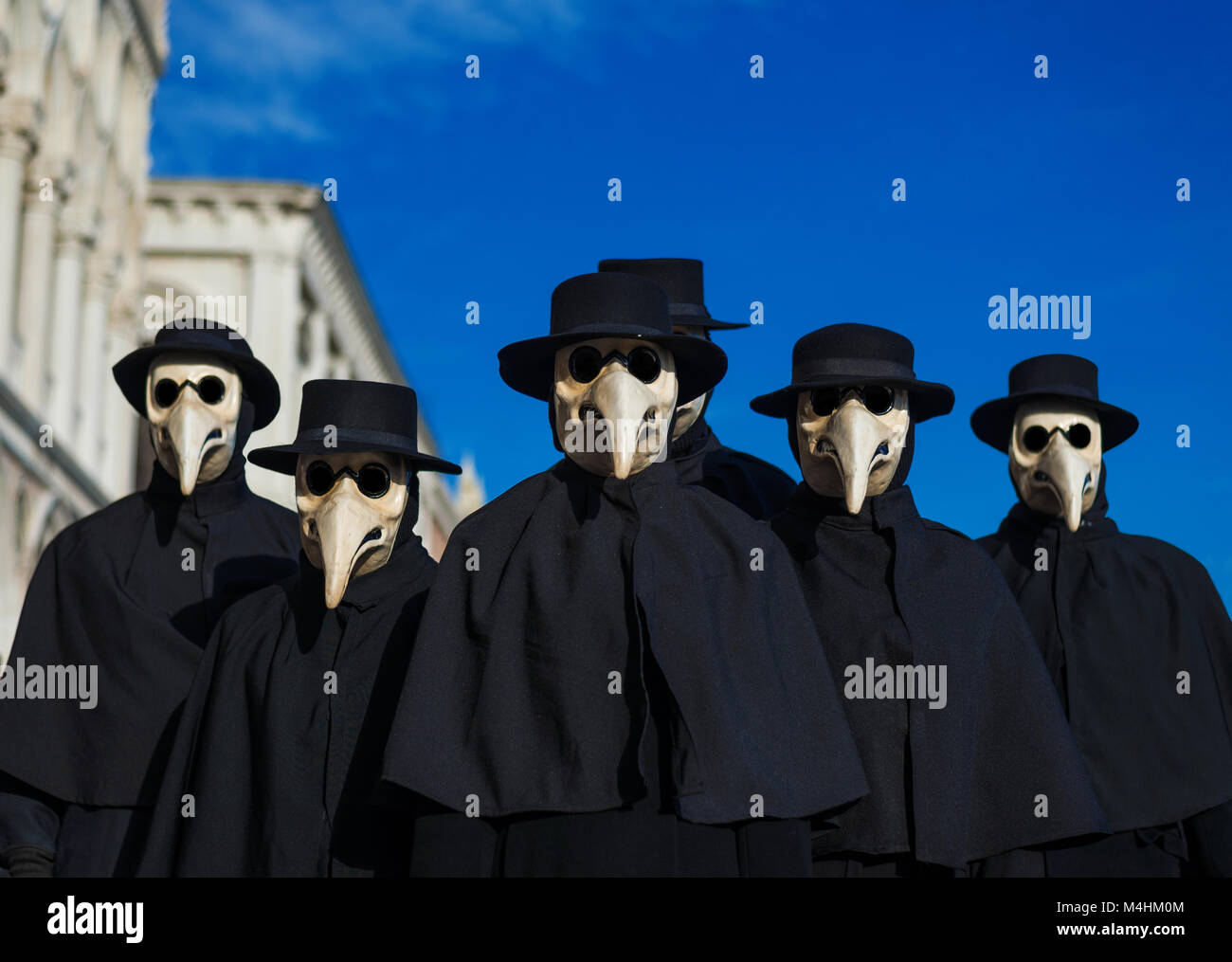 Plague Doctor Masks group, traditional costume invented in the 17th century and historical character of Venice Carnival Stock Photo