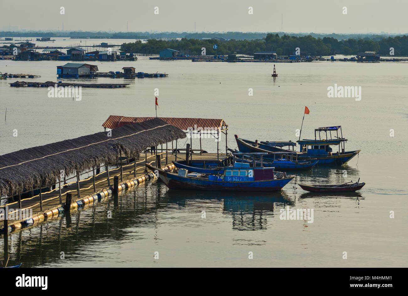 Vung Tau, Vietnam - Feb 6, 2018. Wooden boats docking on pier in Vung Tau,  Vietnam. Vung Tau is a port city, on a peninsula in southern Vietnam Stock  Photo - Alamy