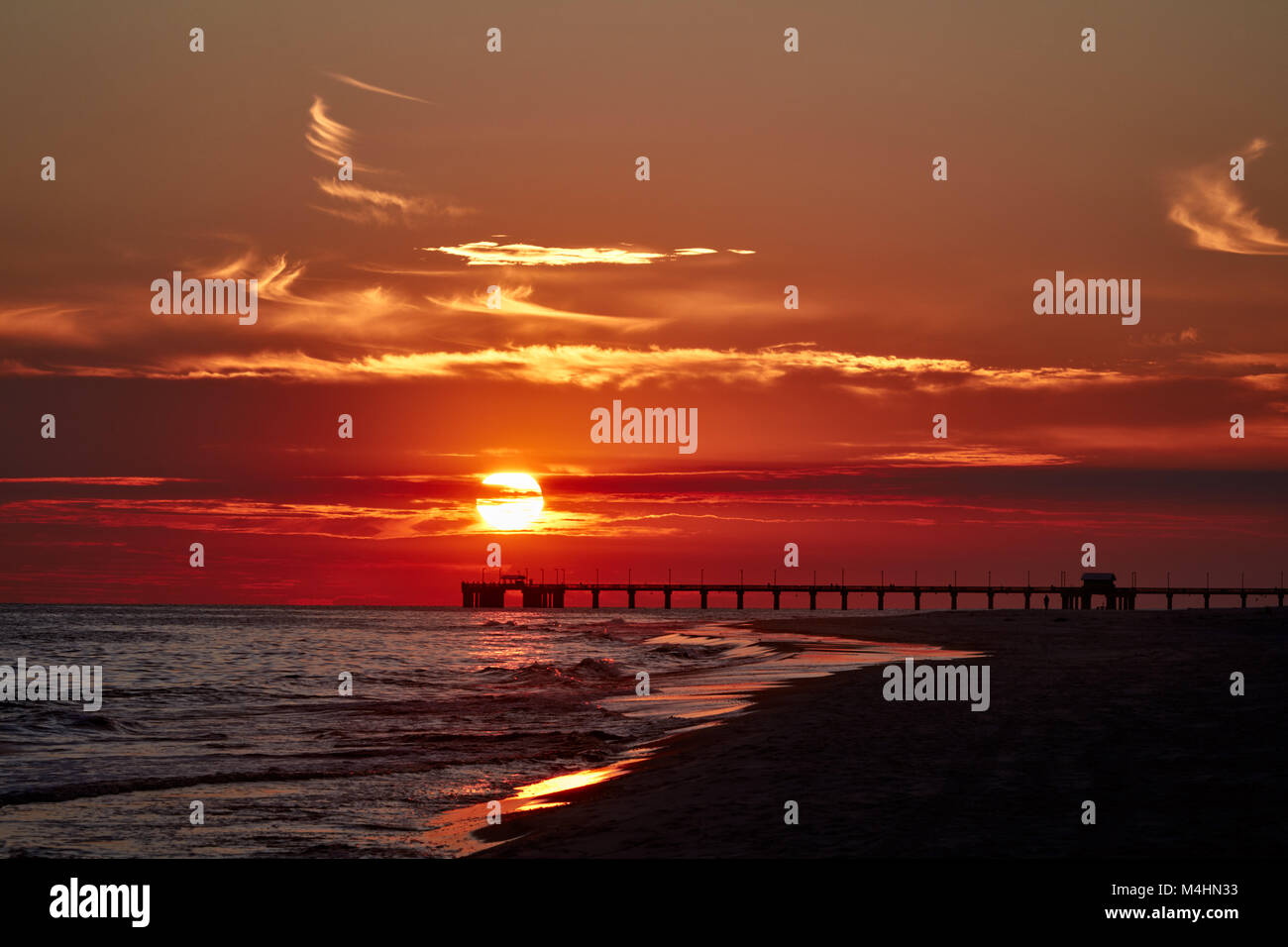 Sunset over the pier, Gulf State Park, Alabama Stock Photo