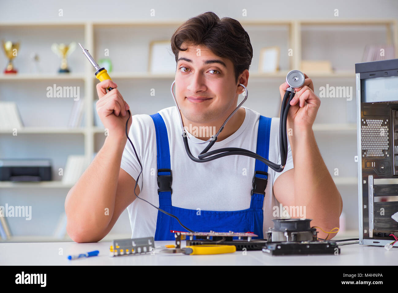 Computer repairman repairing desktop computer Stock Photo - Alamy