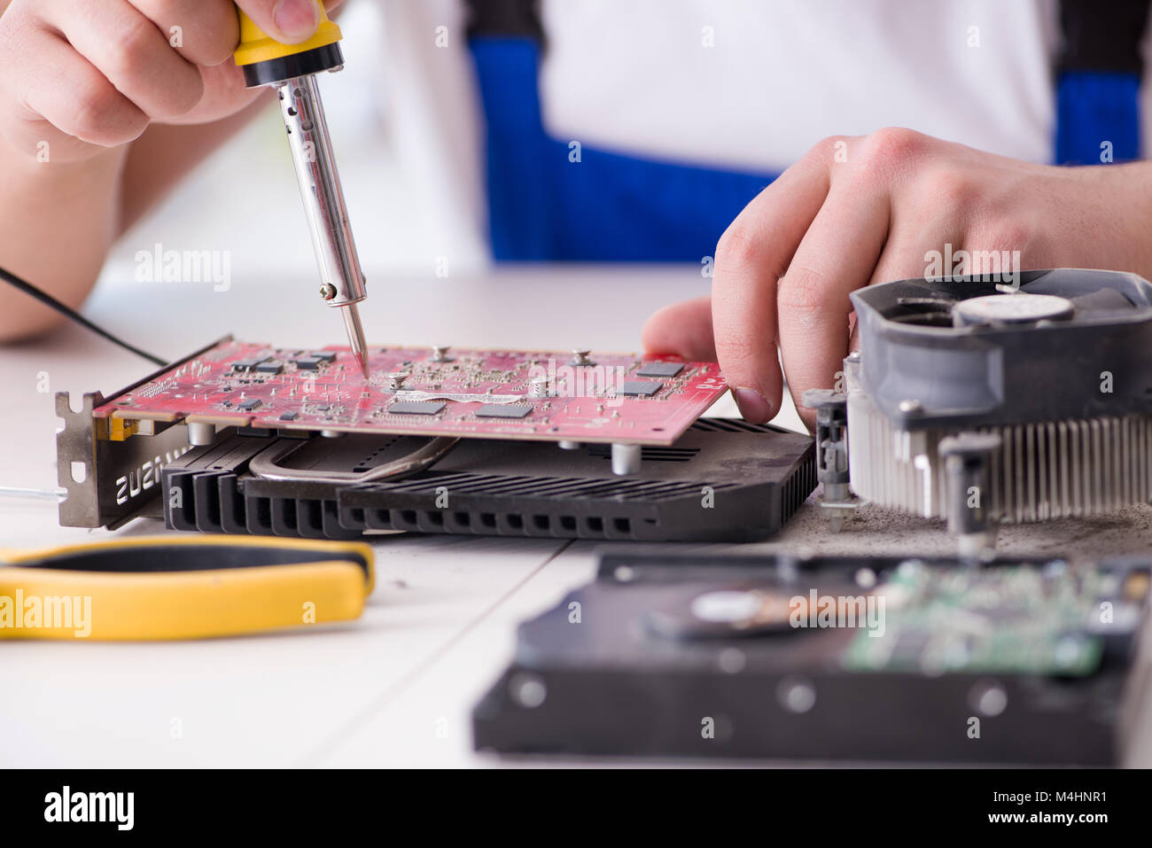Computer repairman repairing desktop computer Stock Photo - Alamy