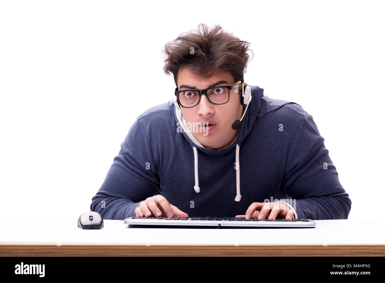 Funny nerd man working on computer isolated on white Stock Photo