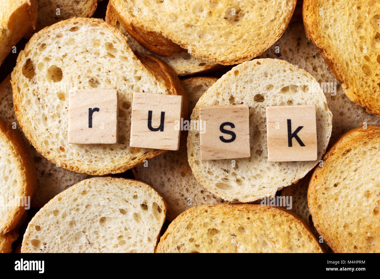 word rusk on many of round rusk background Stock Photo - Alamy