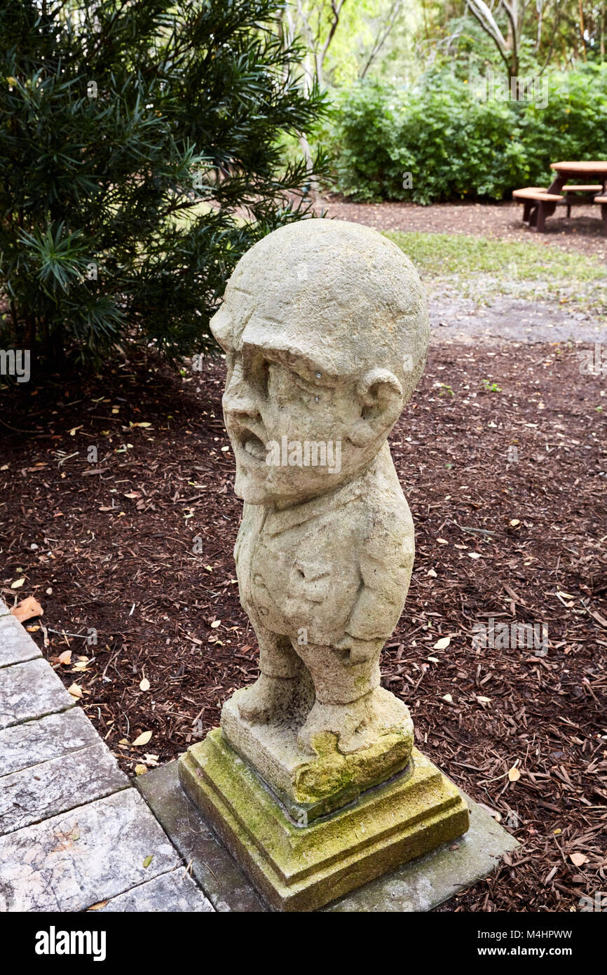 Statue of a small man with a large head at the Ringling Art Museum