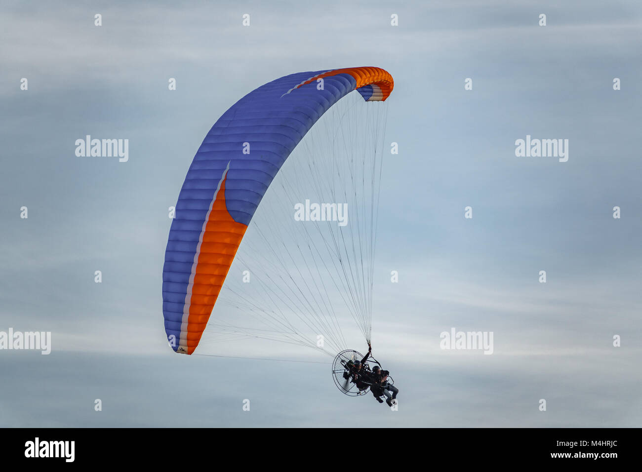 Two unrecognizable persons in paragliding Stock Photo