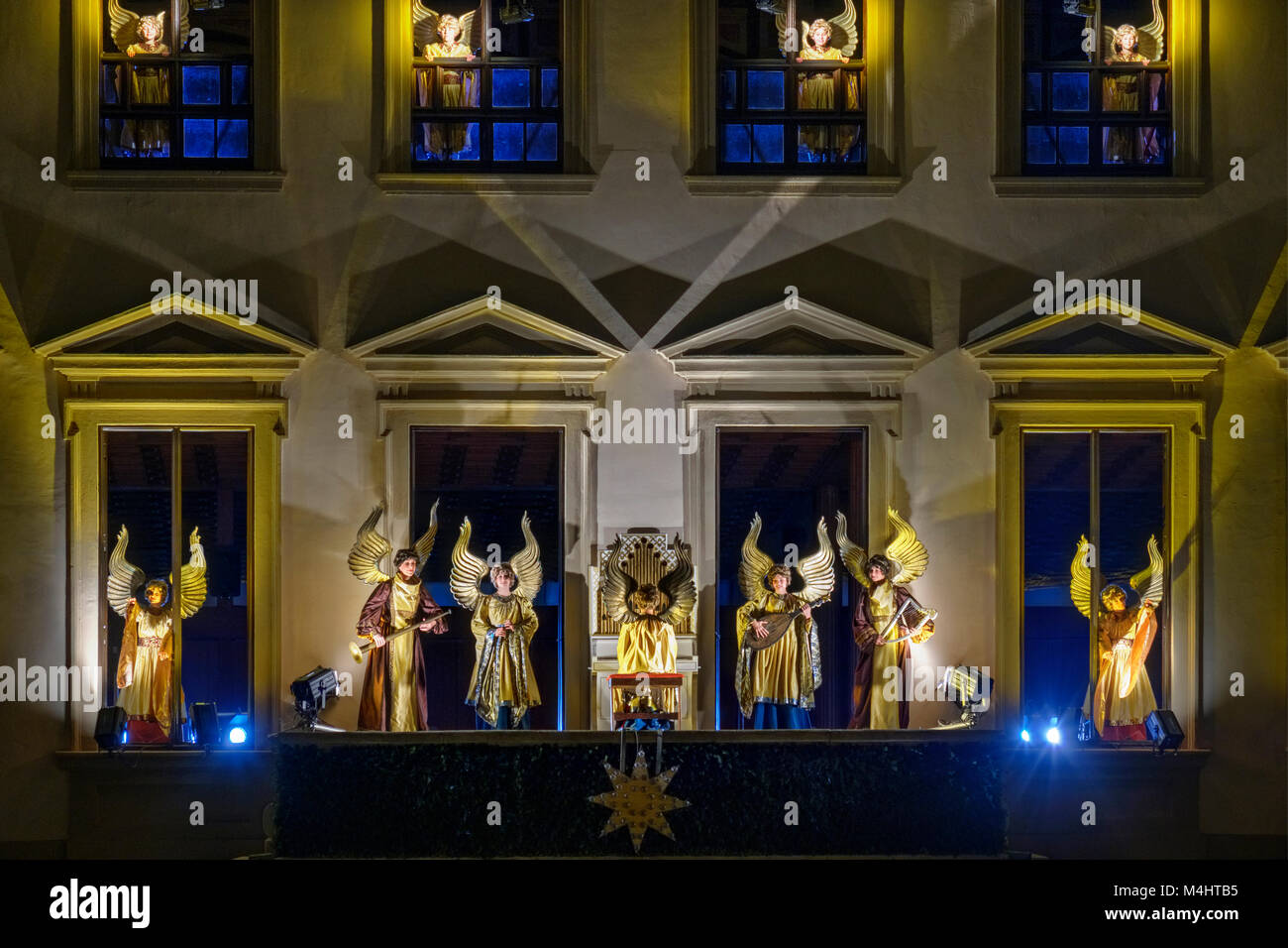 Illuminated angelic play at the town hall by night, Christmas market, Augsburg, Swabia, Bavaria, Germany Stock Photo