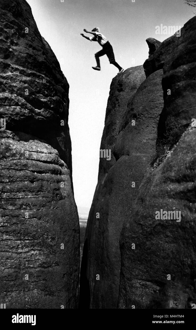 Man jumps over a crevice, historical photograph, mountaineer, ca. 1930, 1930s, Saxon Switzerland, Saxony, Germany Stock Photo