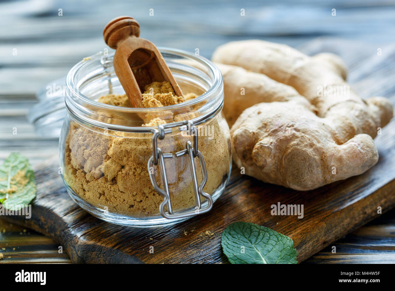 Ground ginger in glass jar and ginger root Stock Photo Alamy
