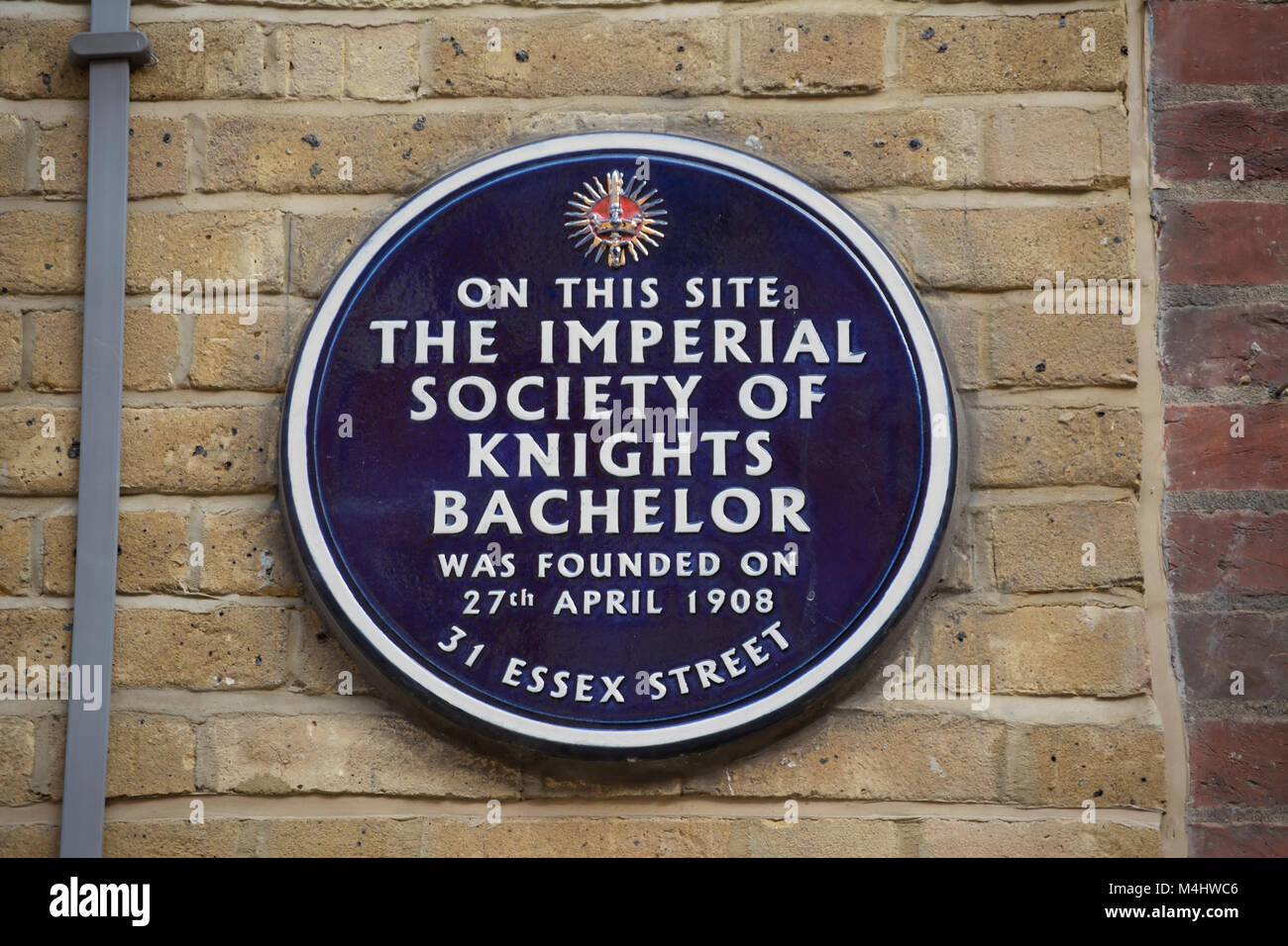 plaque marking the site of the 1908 founding of the imperial society of knights bachelor, essex street, london, england Stock Photo