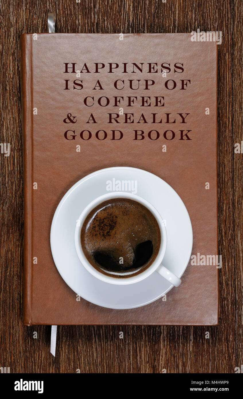 HAPPINESS IS A CUP OF COFFEE & A REALLY GOOD BOOK . A book with a