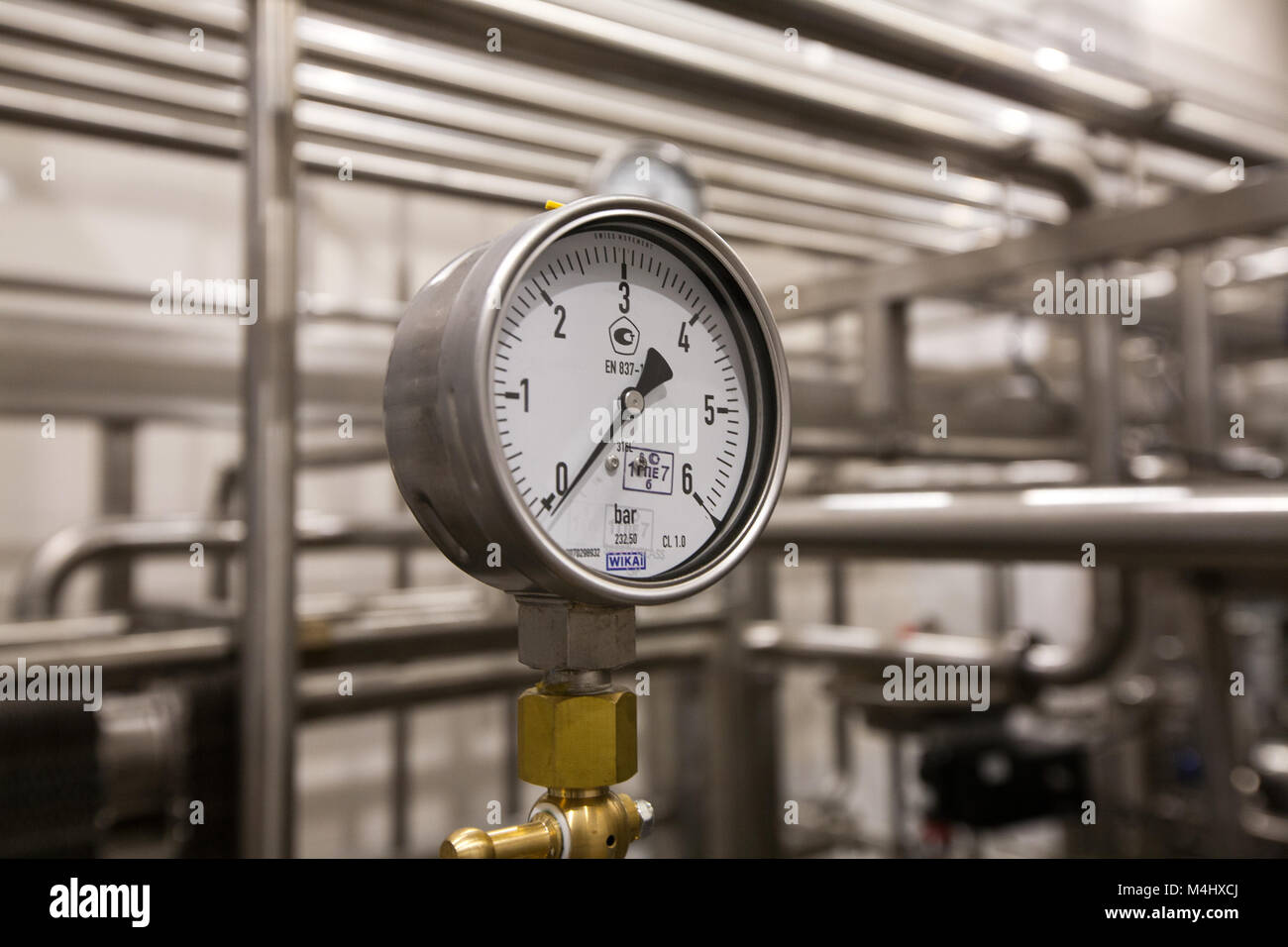 Pressure gauge (manometer) of white metal - brewing equipment. Close-up ...