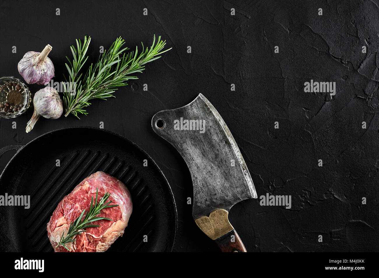 Fresh raw meat. steak A piece of beef tenderloin on grill pan, with a ...