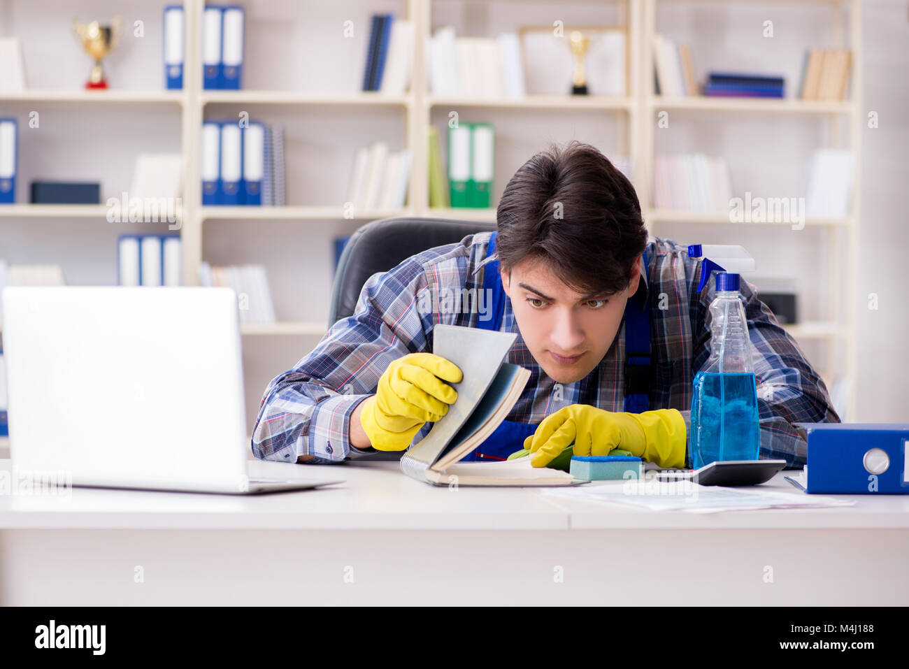 Man cleaner stealing confidential documents Stock Photo - Alamy