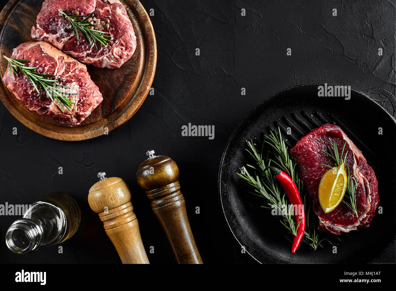 Fresh raw meat. Beef Tenderloin steak and marbled beef steaks on grill ...