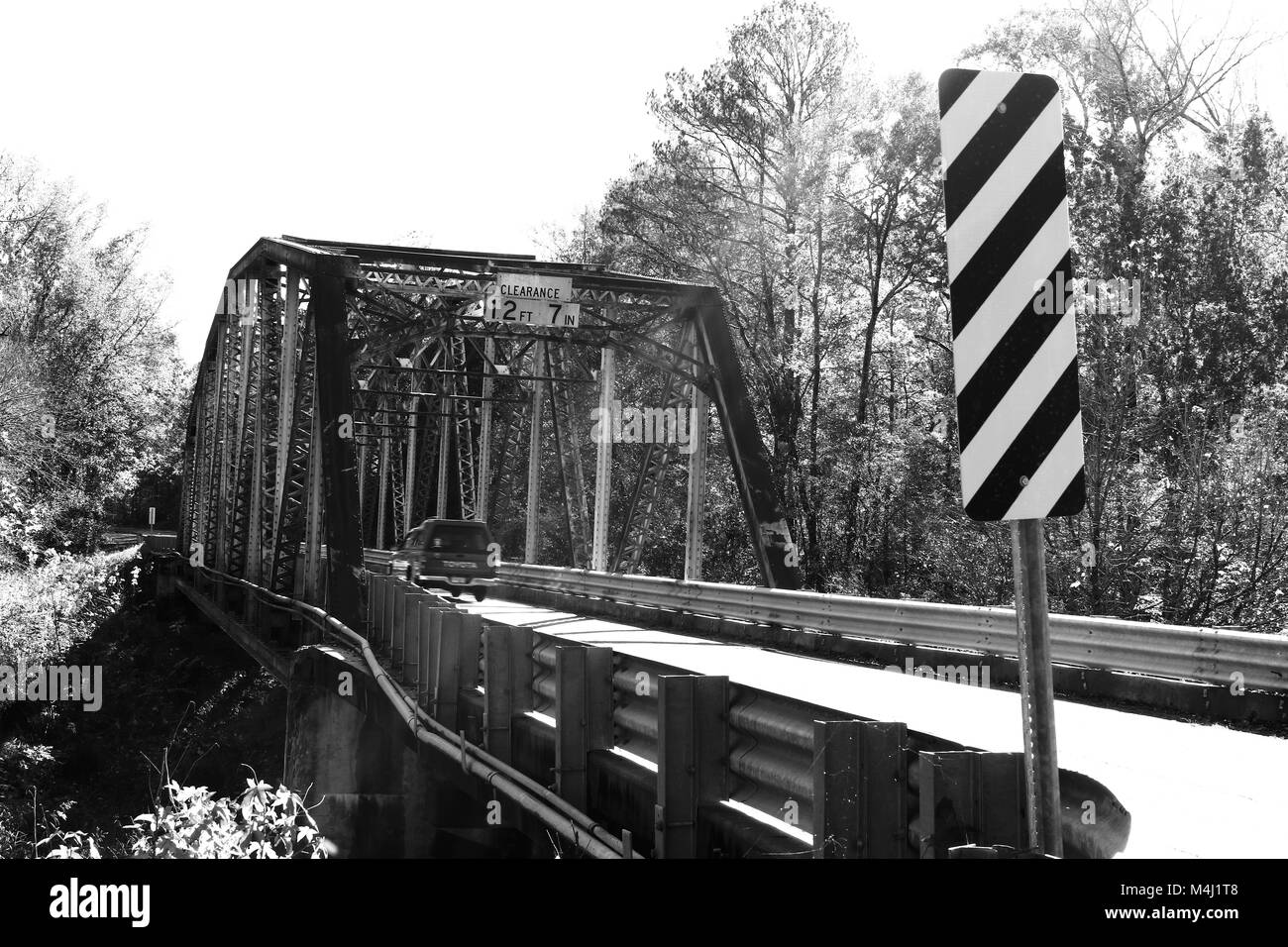 South Carolina ,Mt.Carmel SC, rusty bridge,sun flare,black & white bridge,vintage bridge,background,Little River Truss Bridge,steel bridge,old bridges Stock Photo