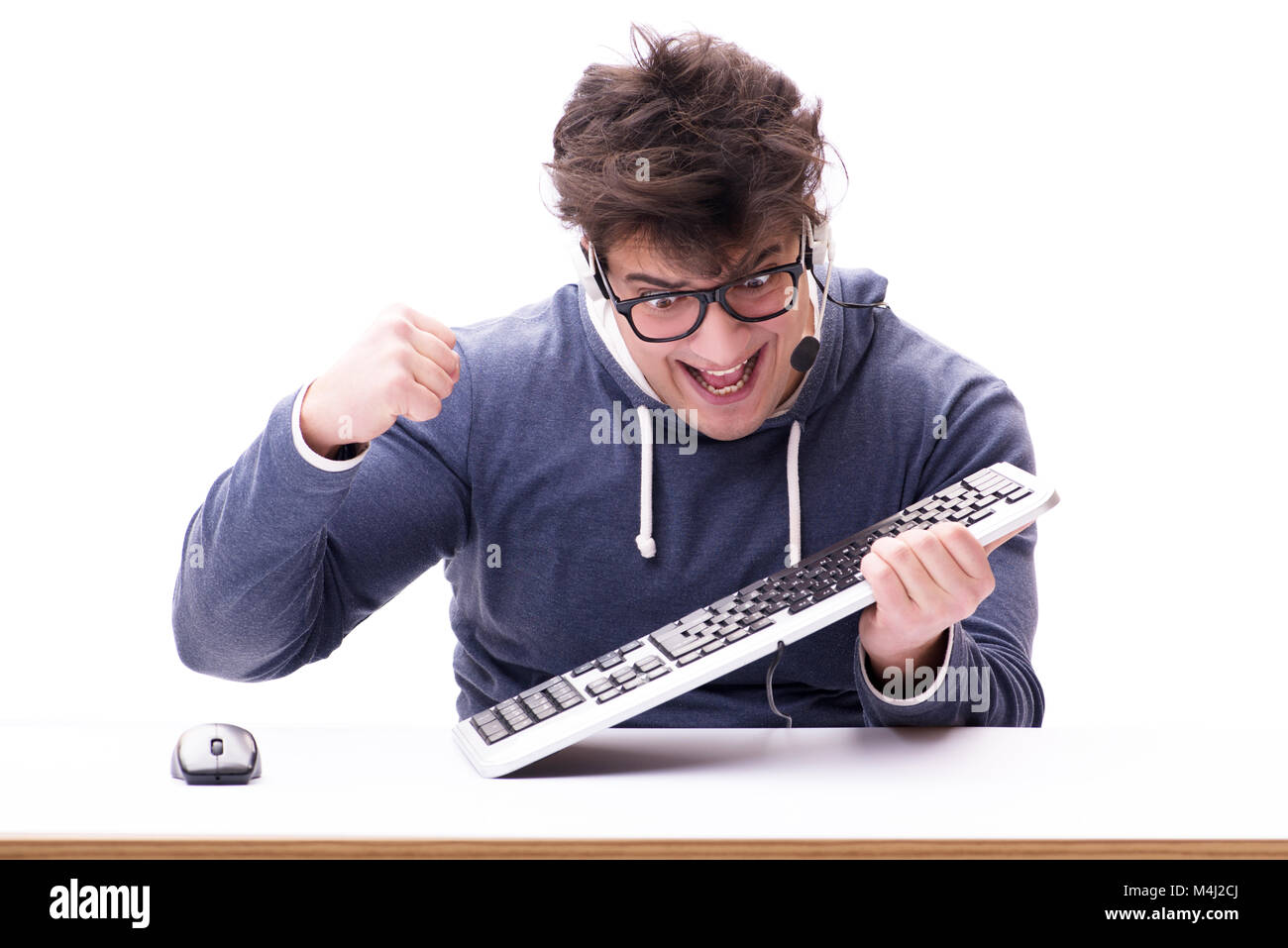 Funny nerd man working on computer isolated on white Stock Photo