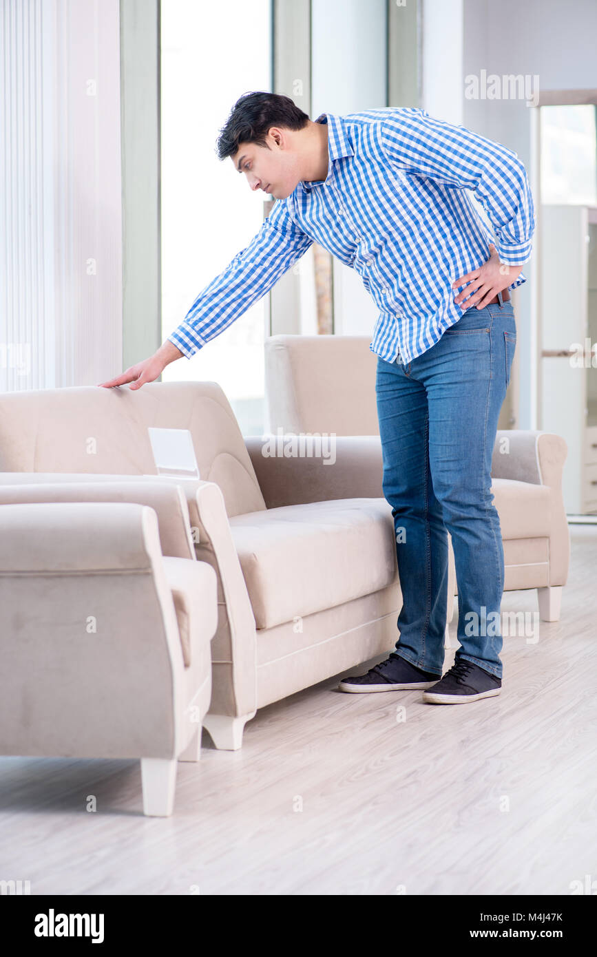 Young man shopping in furniture store Stock Photo - Alamy