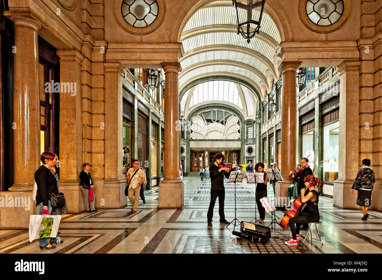 Italy Piedmont Turin Galleria san Federico - Street Artist - Musician play classic music Stock Photo