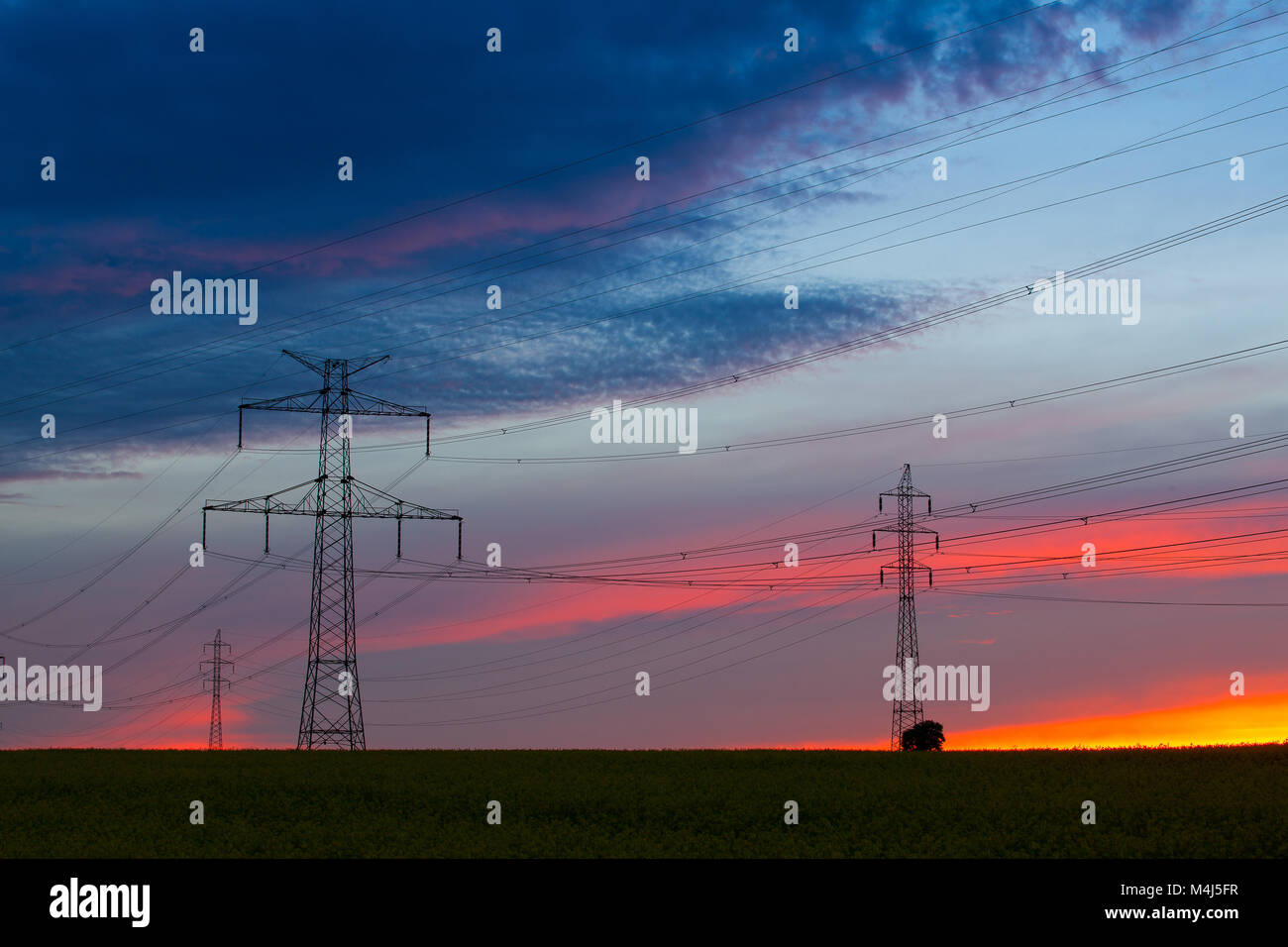 Silhouette of high voltage electrical pole structure at sunset Stock ...