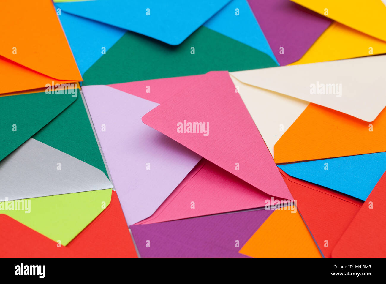 Different colored envelopes on the table Stock Photo