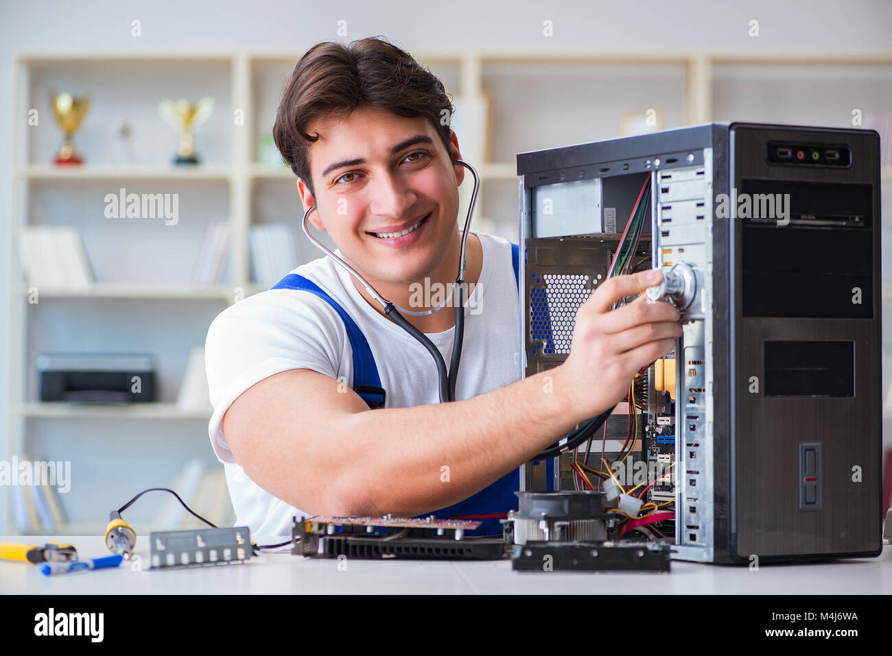 Computer repairman repairing desktop computer Stock Photo Alamy