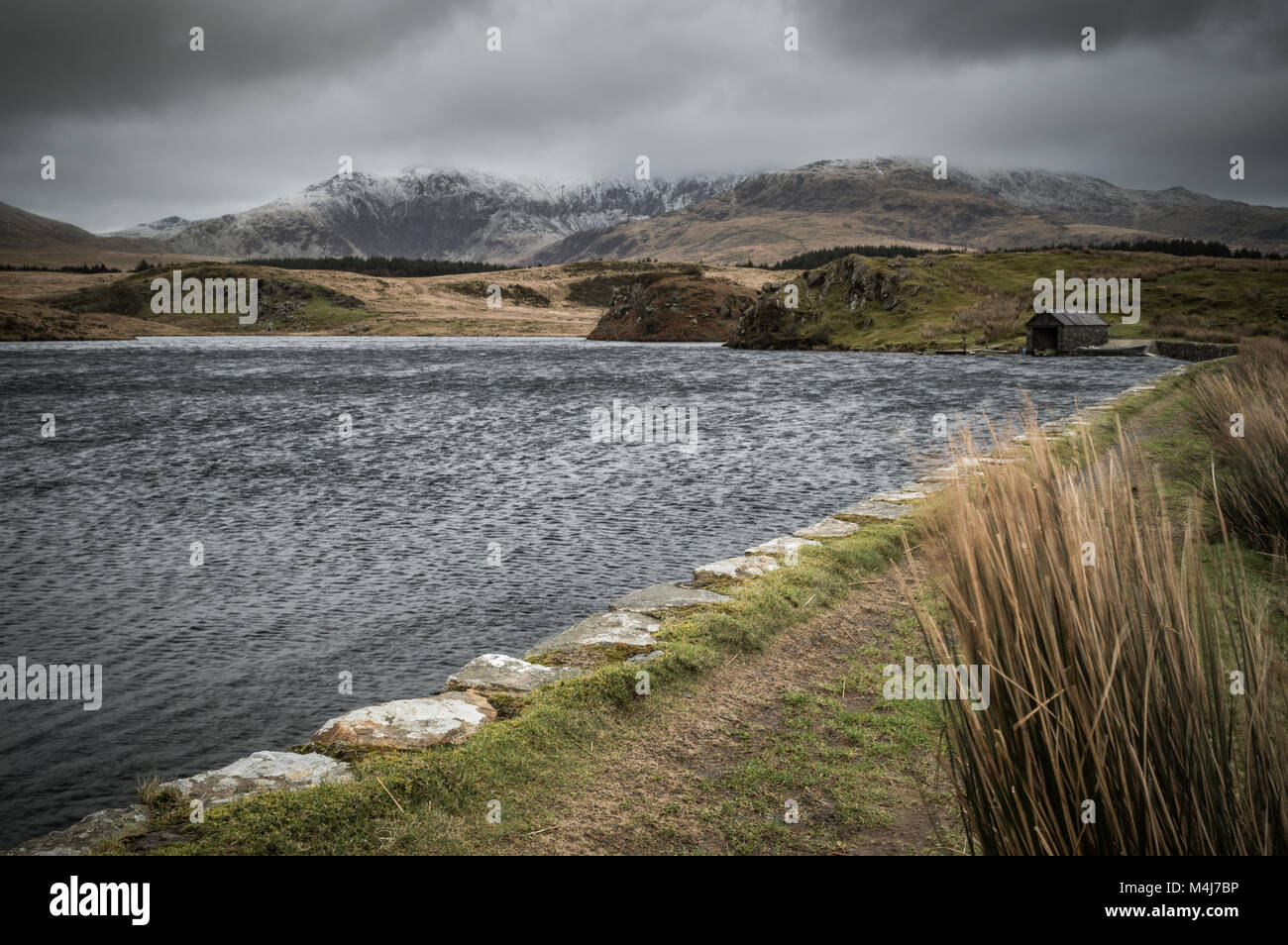 View across the lake to Mount Snowdon and the boathouse at Llyn Y ...