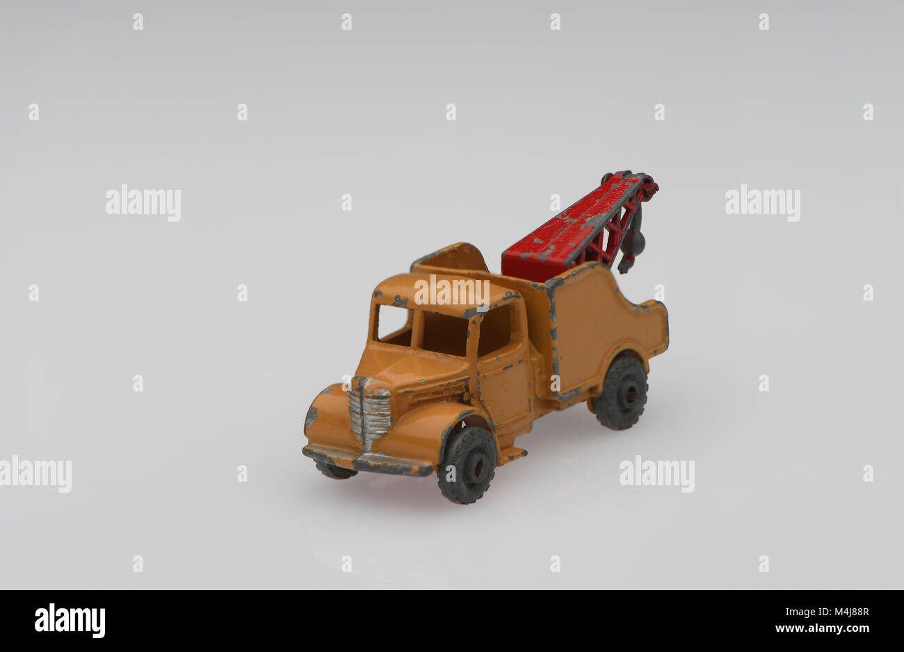 A Lesney vintage brown toy wreck truck on a white background. Stock Photo