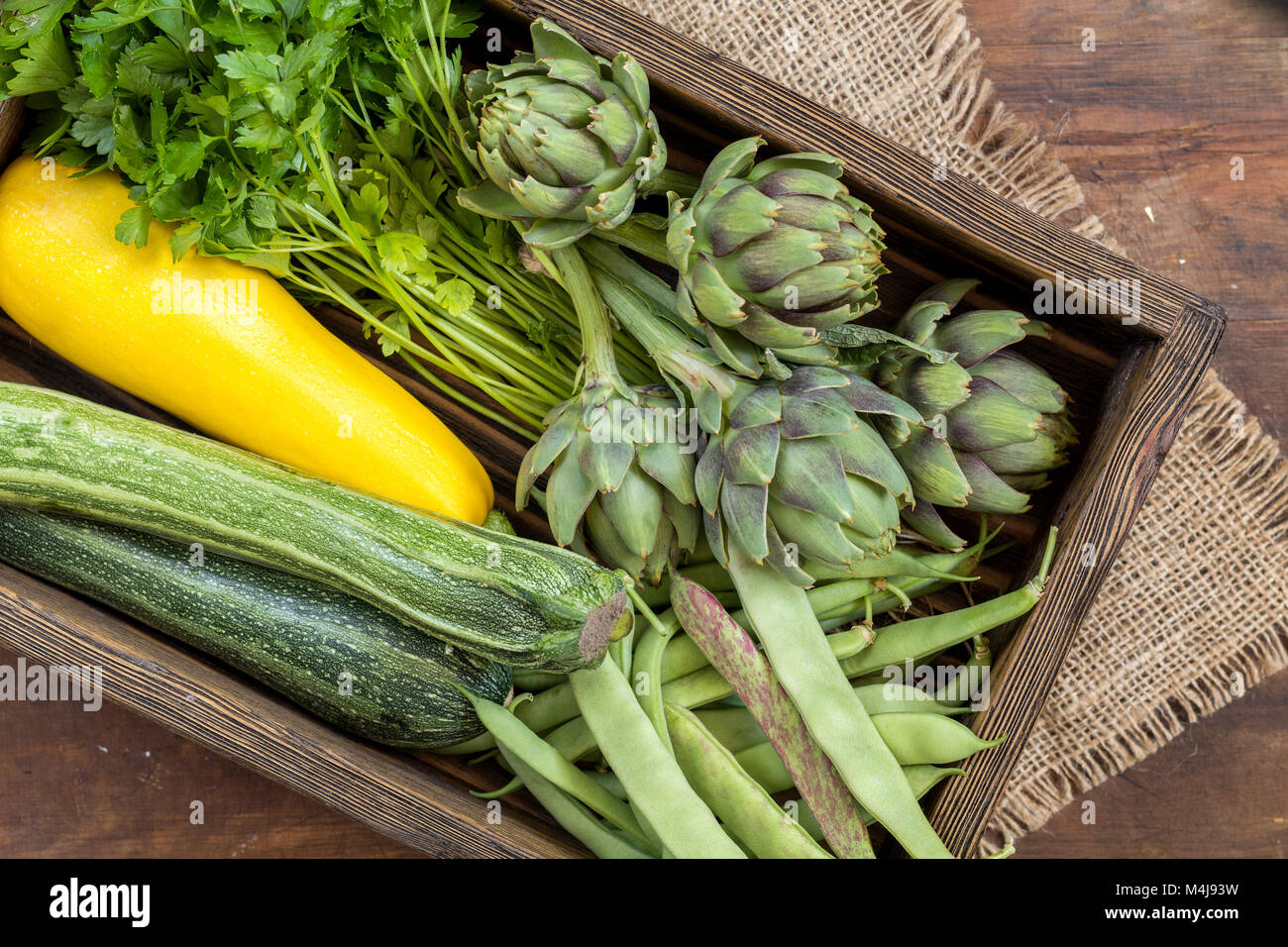 Fresh organic green vegetables on wooden floor Stock Photo - Alamy