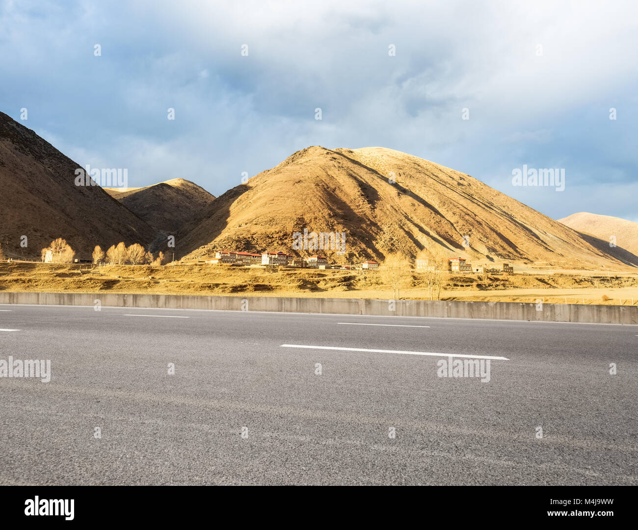empty asphalt road in tibetan area Stock Photo