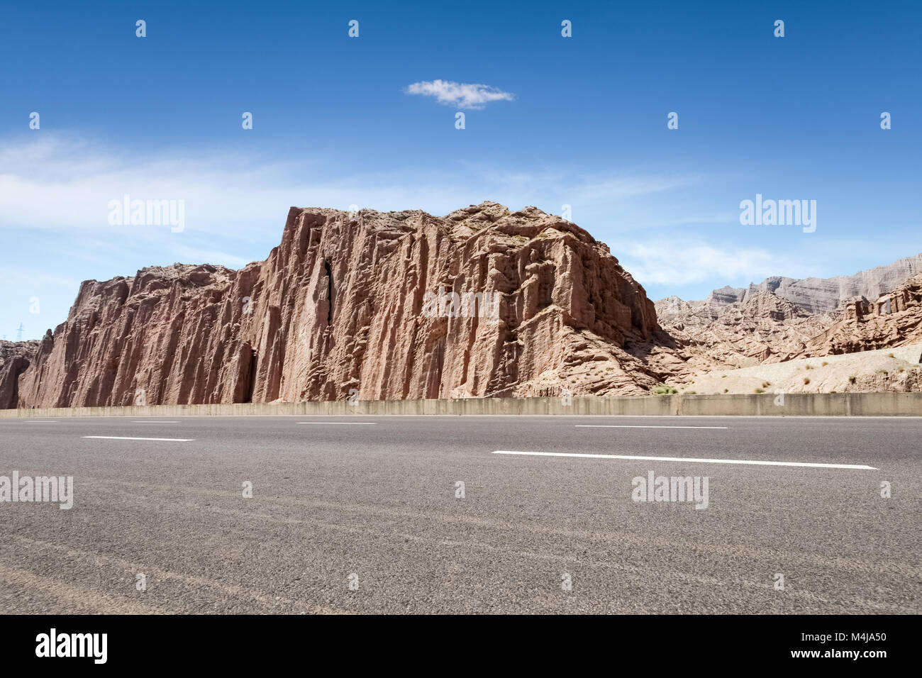 empty asphalt road with xinjiang geological landscape Stock Photo
