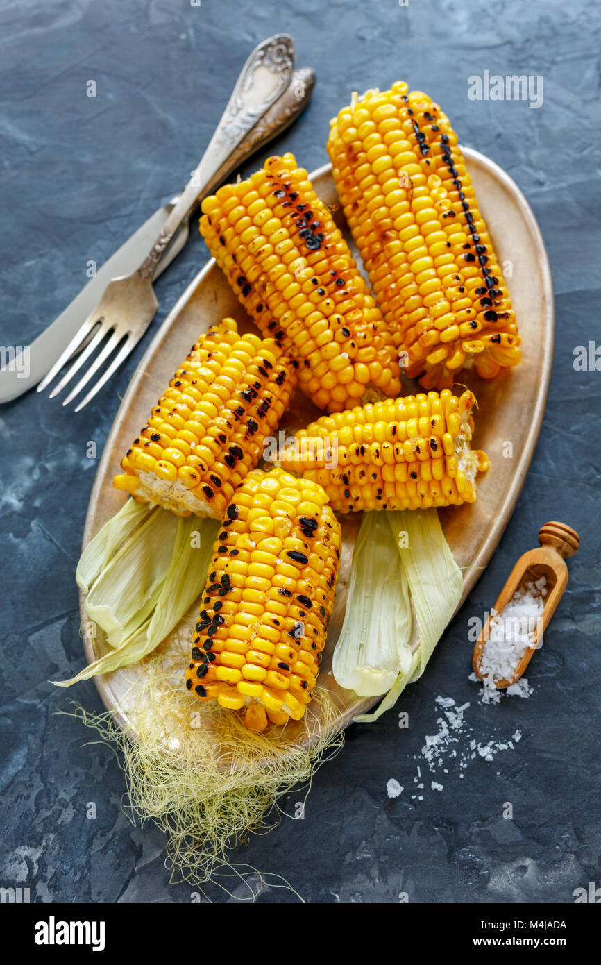 Cobs sweet corn grilled with sea salt. Stock Photo