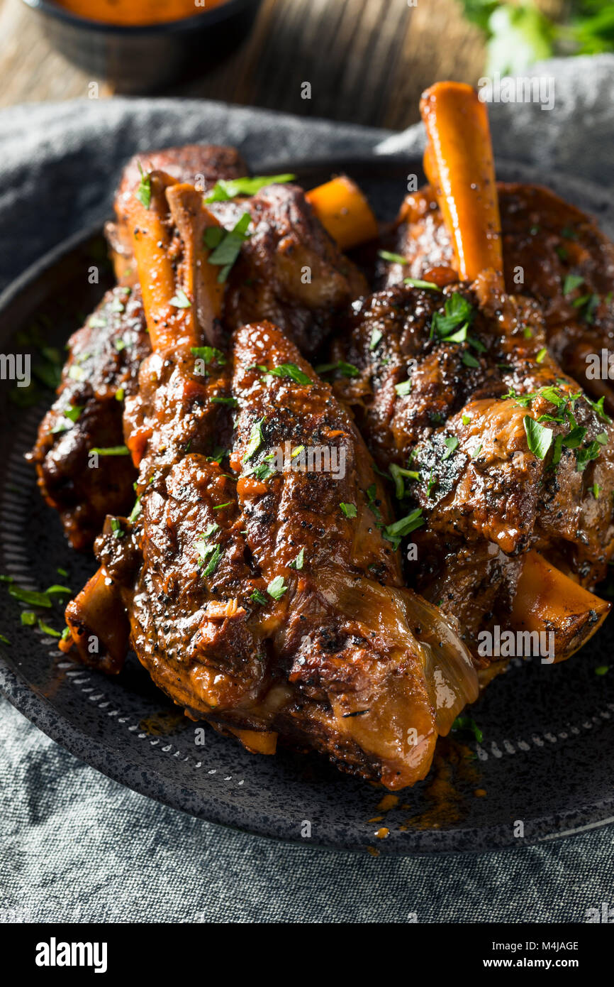 Homemade Braised Lamb Shanks with Sauce and Herbs Stock Photo Alamy