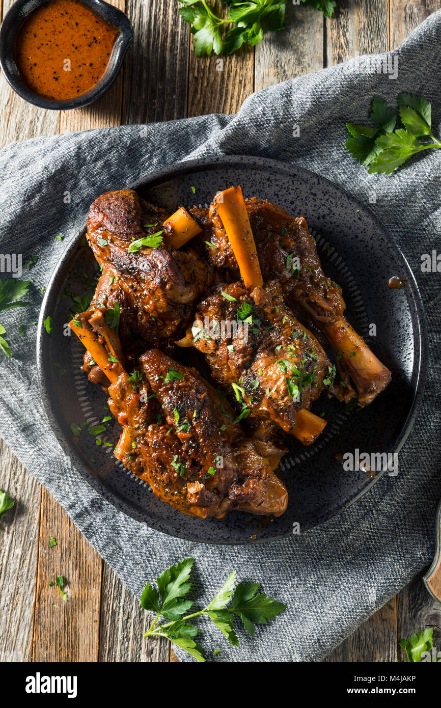 Homemade Braised Lamb Shanks with Sauce and Herbs Stock Photo Alamy